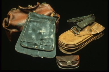 Four types of leather bags and a belt in different colours.