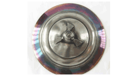 Red and blue interference colours on the outer edges of a silver object.