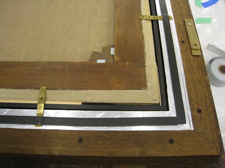Photograph of back right corner of frame, showing the sealing tape used to secure keys.