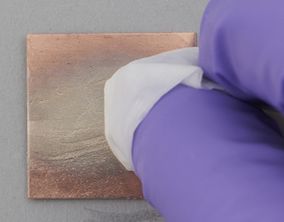 Pure copper coupon after the second application of a silvering paste over the centre
