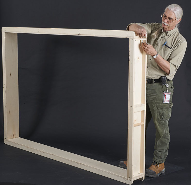 Plywood channels being assembled