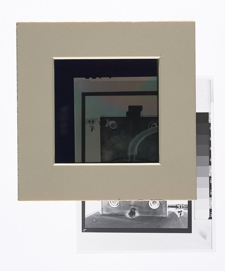 When polarizing filters are crossed with a piece of polyester sandwiched between the two filters, the negative becomes visible