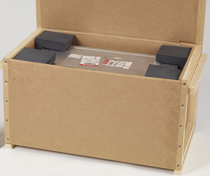 Corrugated container with added extra protective cushioning to an existing package