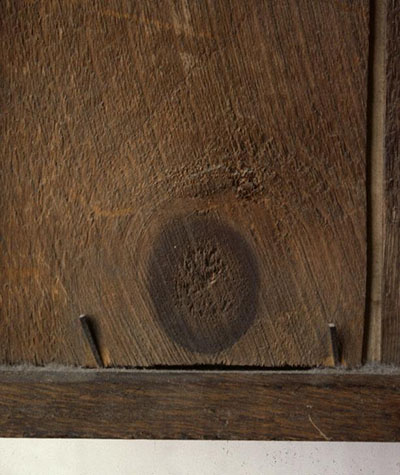 Large knot on a back wooden panel.