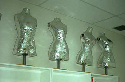 Mannequins made of papier-mâché and covered with plastic-laminated aluminum foil.