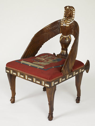 Egyptian revival armchair uncovered.