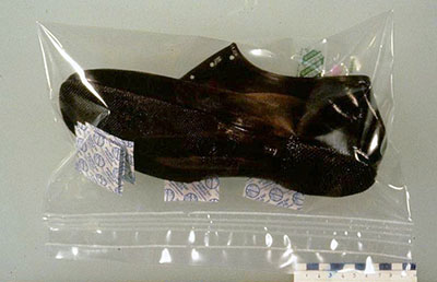 A natural rubber shoe sealed in a bag made of multi-layer film.
