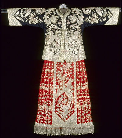 A Chinese wedding gown supported by a Plexiglas rod.