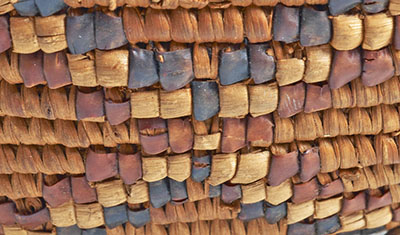 Detail of a basket with an X-shaped pattern.