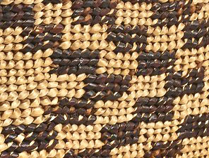 Detail of a twined basket with an overlay.