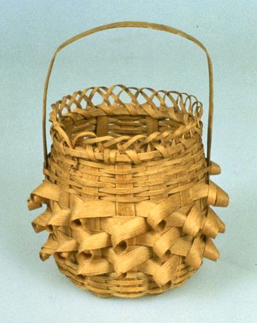 A splint basket with decorative elements.