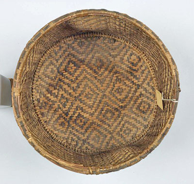 Basket with water stains on the interior of the base.