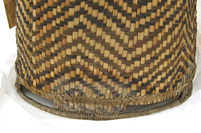 Basket with a water stain on its exterior.