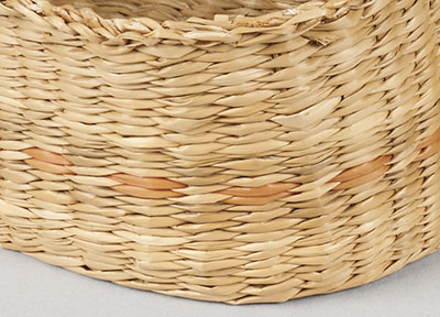 Detail of a basket made of grass stems.