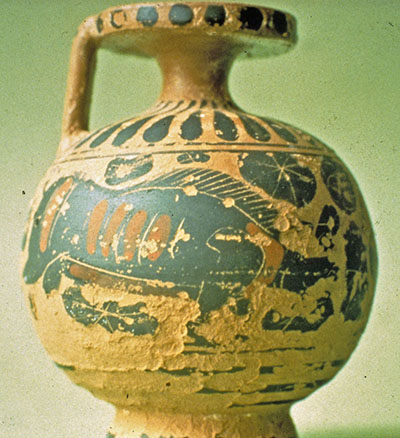 The original surface of a ceramic vessel has spalled off or been lost.