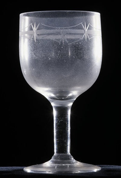 An unstable wineglass that is foggy.
