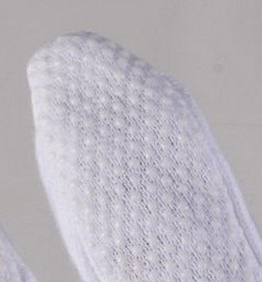 Detail of Polyvinyl chloride dots from Sure Grip cotton gloves.