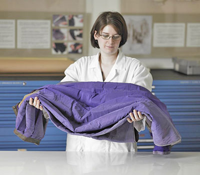 A structurally stable garment is lifted from a work surface.