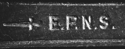 The letters E.P.N.S. engraved on the back of a fork.