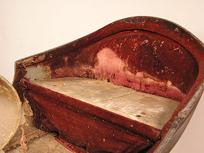 A sleigh's upholstery was extensively damaged by insects.