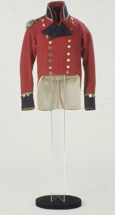 A military tunic displayed on a custom mannequin and stand.