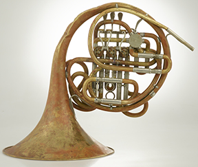 French horn showing pink areas typical of dezincification