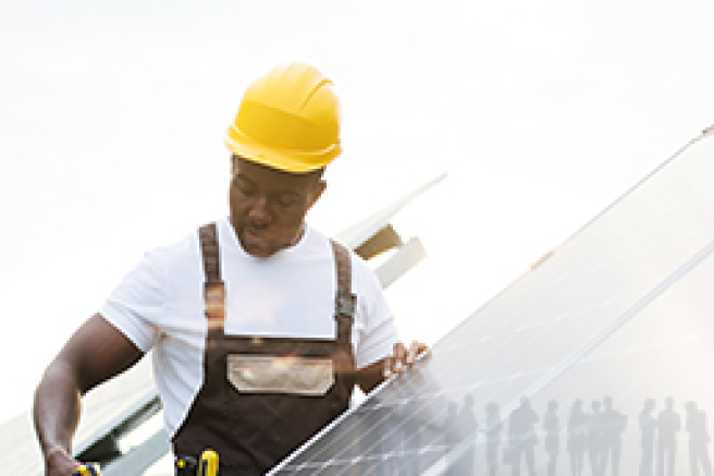 Men installing a solar panel.