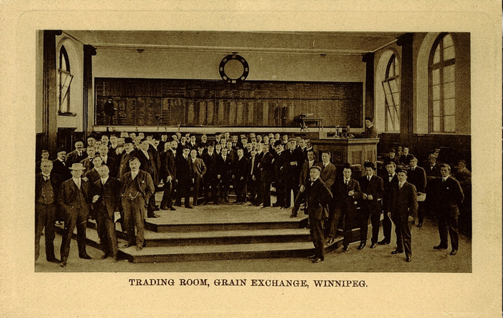 Group photo of traders in Winnipeg Grain Exchange building.