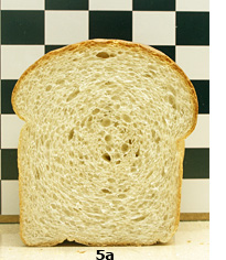 5a. A loaf of wheat bread made with barley fibre-rich fraction, cut to show interior of loaf.