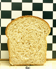 6c. A loaf of wheat bread made with whole wheat flour, cut to show interior of loaf.