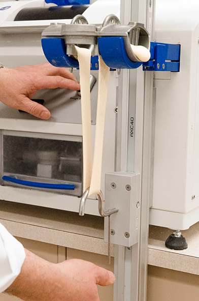 Dough mixing develops a gluten protein network that gives the dough its strength and stretchiness.