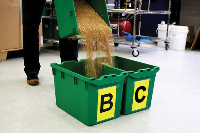 pour the contents of pail A at the point where the pails touch, ensuring that half the stream flows into each pail labelled B
