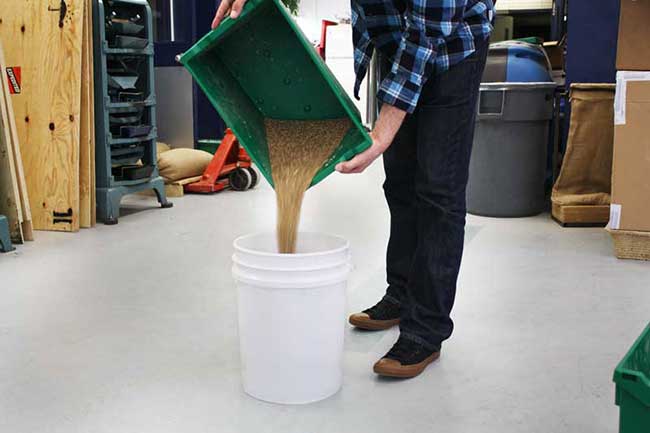 pour the contents of the other pail labelled B back into the bin