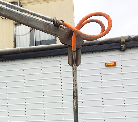 Photo of a rubber hose for grain and air transportation from the probe to the sample collection box.