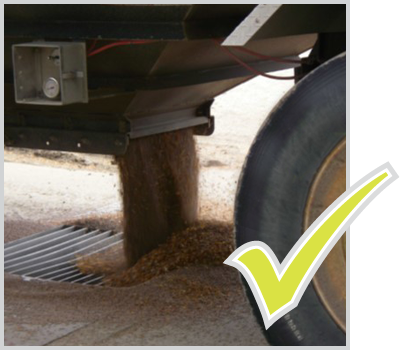 A photo of good grain flow for sampling during unload, and a photo of poor grain flow choking the pit during unload. Text version below.