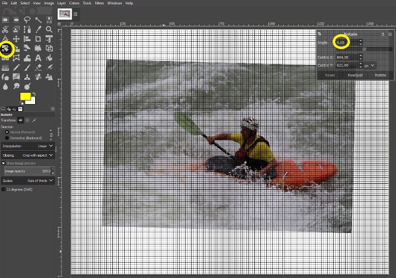 Screenshot of a photo of a whitewater paddler being rotated in the GIMP image editing application.