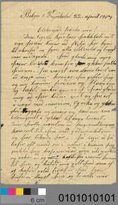 Colour image of paper document with cursive hand-writing, also includes a colour and size scale