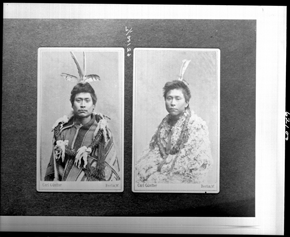Double portrait of two seated men wearing traditional First-Nations garb, black and white image.
