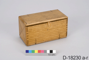 Front view of a wooden box with a catalogue number: D-18230 a-r