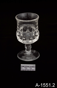 Colour photo of glass wine goblet with catalogue number A-1551.2 on a black background.