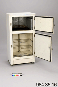 Colour photo of white refrigeration device with upper and lower sections open, with catalogue number 984.35.16 on a grey background.