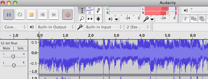 Image: screen shot section of Audacity showing recording levels set too high – red recording bars often extend the full range of the meter.