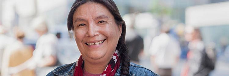 Image of an Indigenous woman smiling
