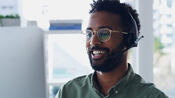 image of a man talking with a headset