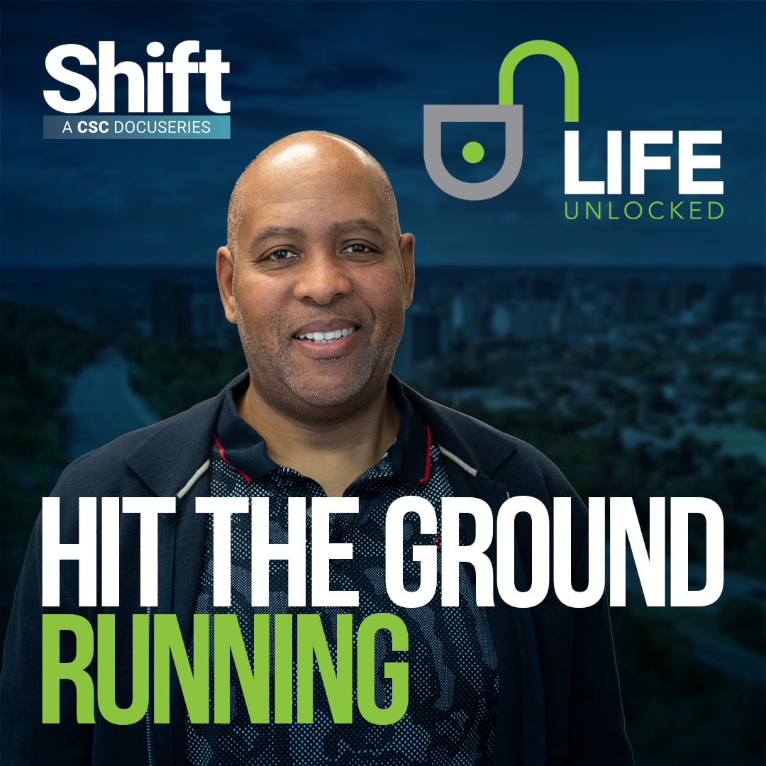 A visual with a blurred cityscape, photo of Joe and Life Unlocked logo, featuring an open padlock icon with the text: « Hit the ground running. Shift CSC Docuseries.»