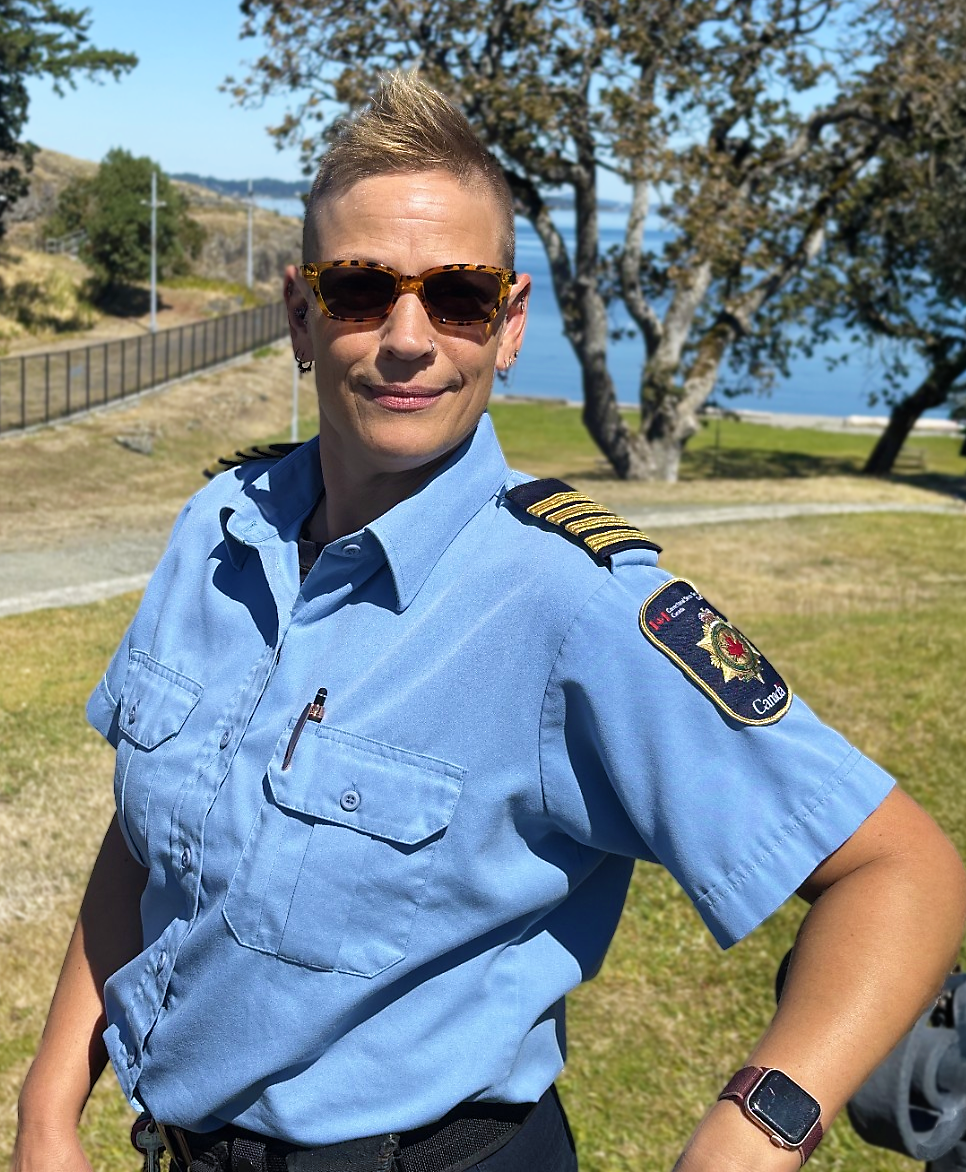 a woman with short hair and sunglasses wearing CSC’s uniform.