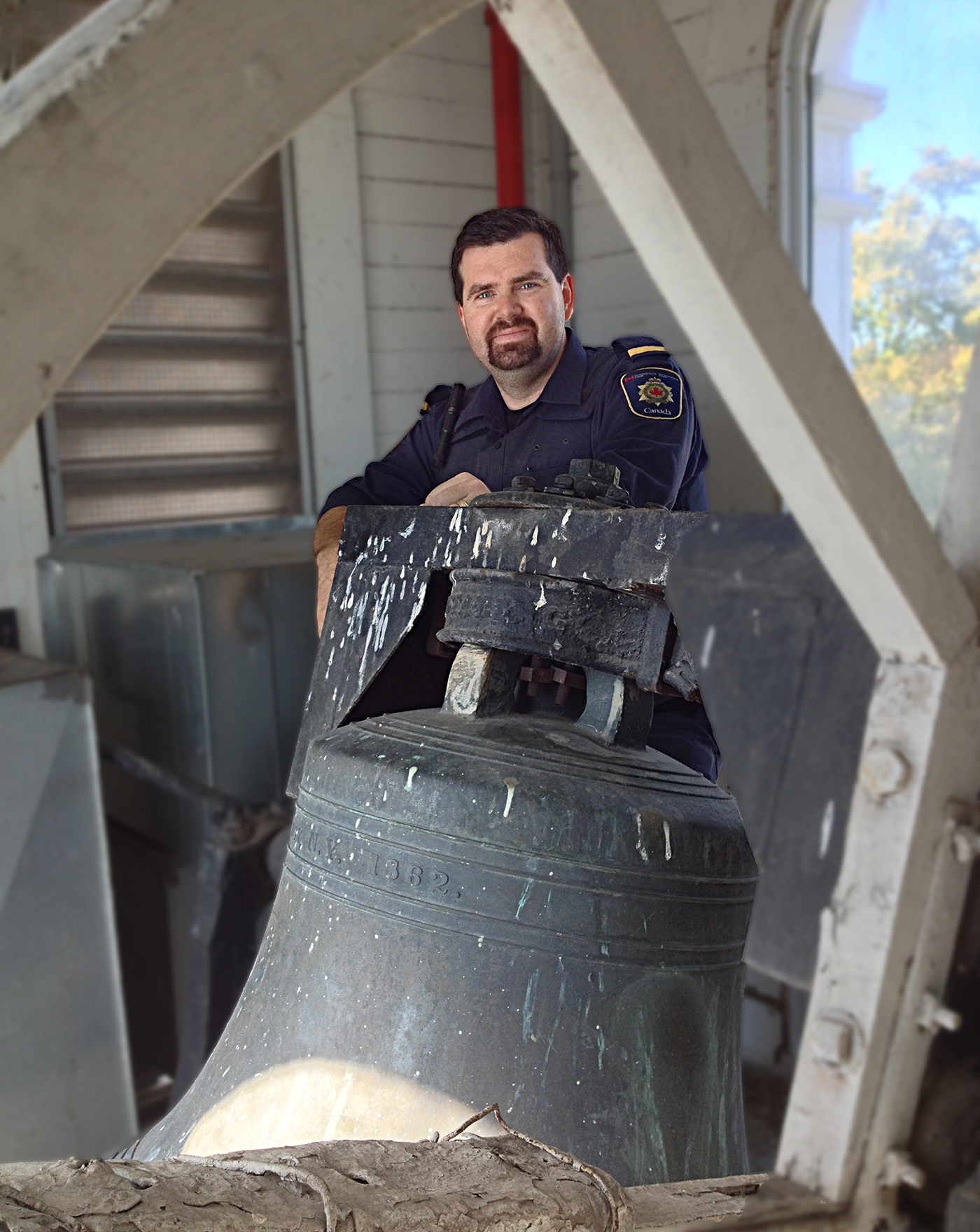 a man with dark hair and a beard wearing the Correctional Service of Canada uniform