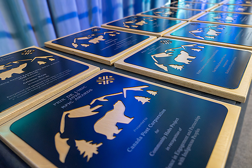 Award plaque made in wood and metal. The Real Property Institute of Canada logo and a polar bear is engraved in the plaque. 