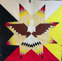 courtepointe décorée d’un motif étoilé et aigle