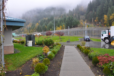 Mountain Institution in Agassiz, British Columbia, pictured on a cloudy day, with trees in the background.